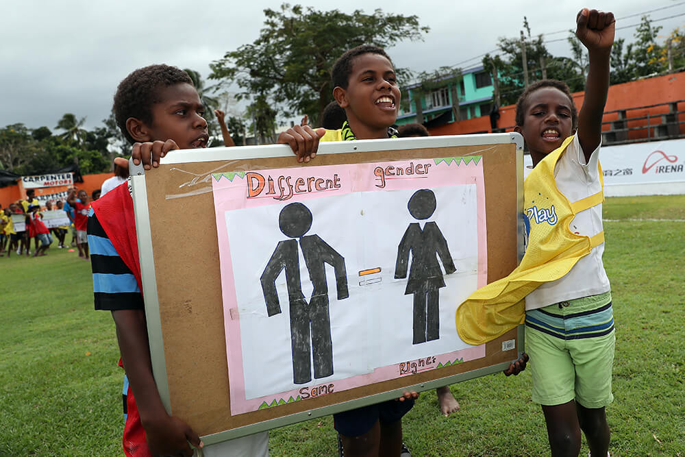 Young children play football in Vanuatu