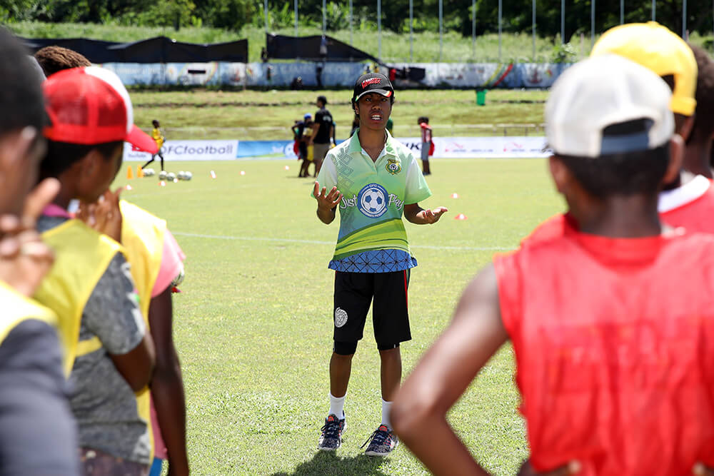 Young children play football in Vanuatu
