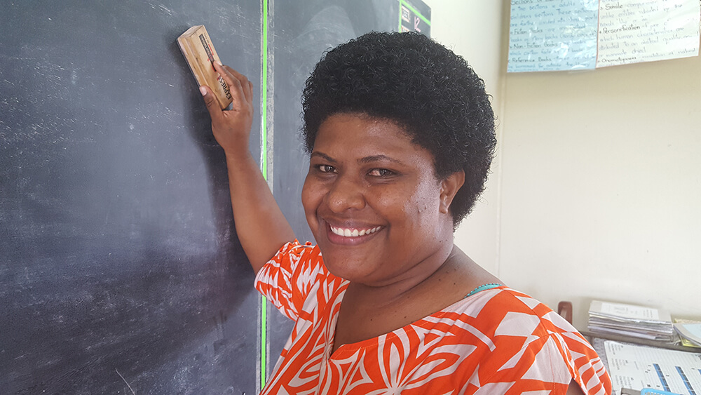 Volunteers and community members playing rugby in Fiji