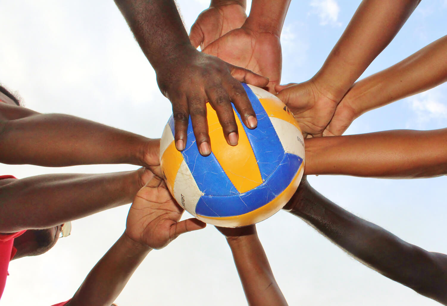 hands on a valleyball 