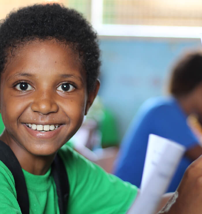 child smiling in class