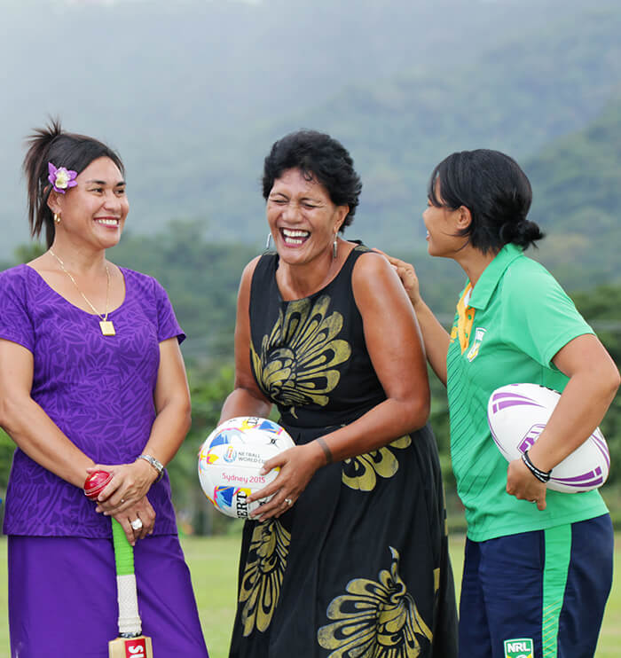 Woman laughing holding sports items