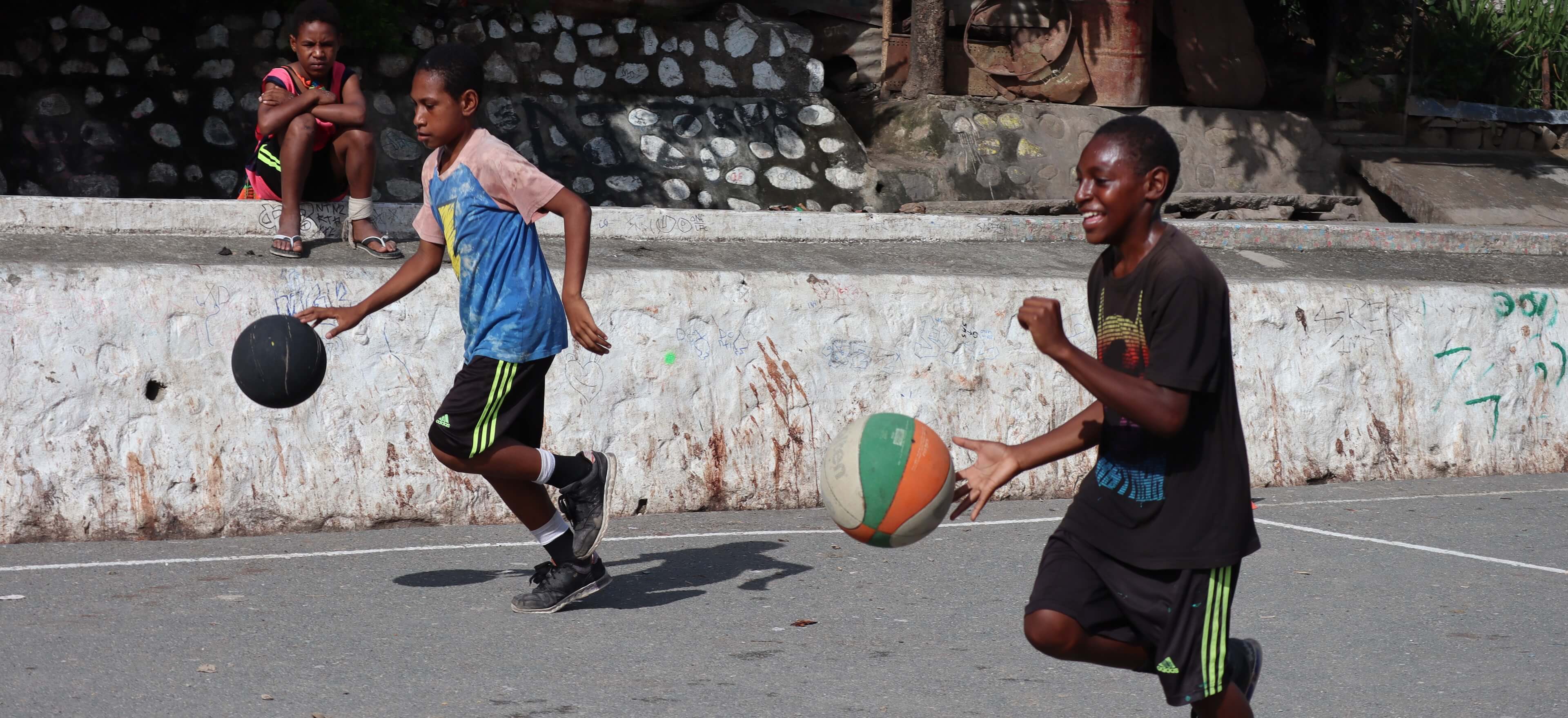 Boys play basketball
