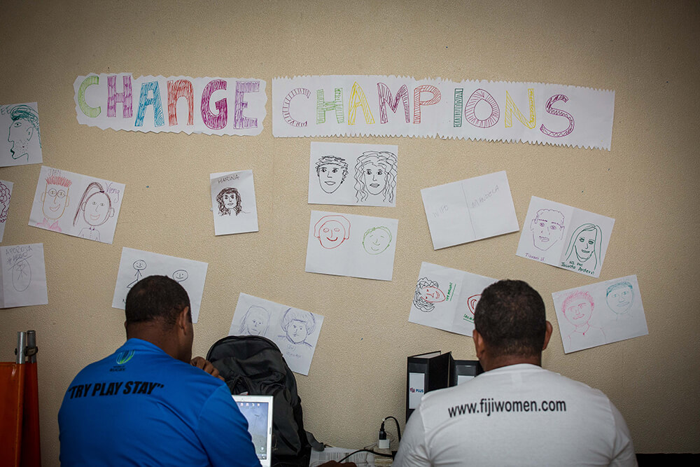Volunteers and community members playing rugby in Fiji