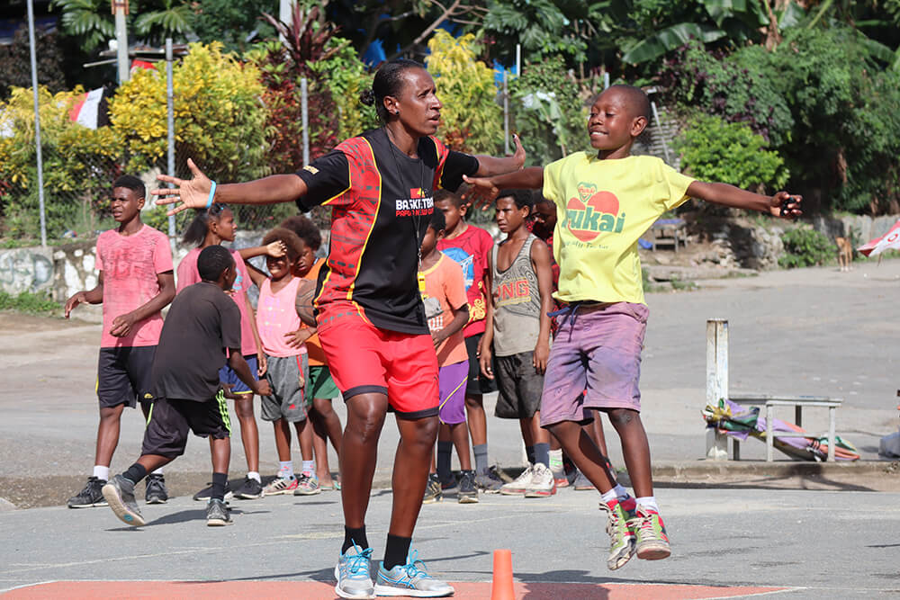 Young people play basketball in Papua New Guinea