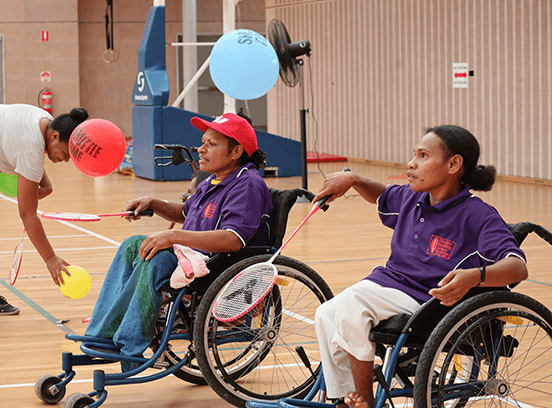 Women in Papua New Guinea playing badminton in wheelchairs 