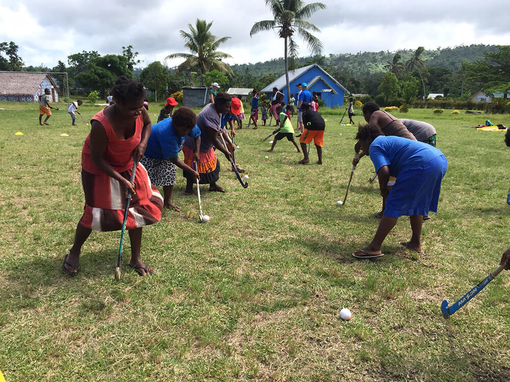 women playing hockey