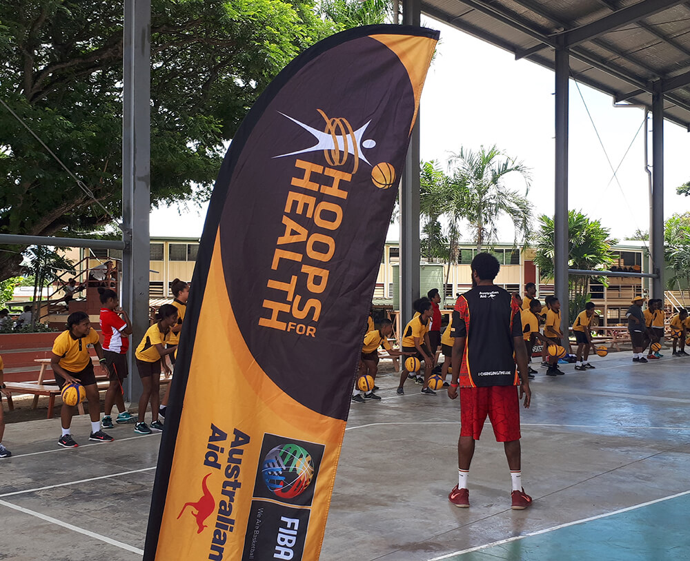 Young people play basketball in Papua New Guinea