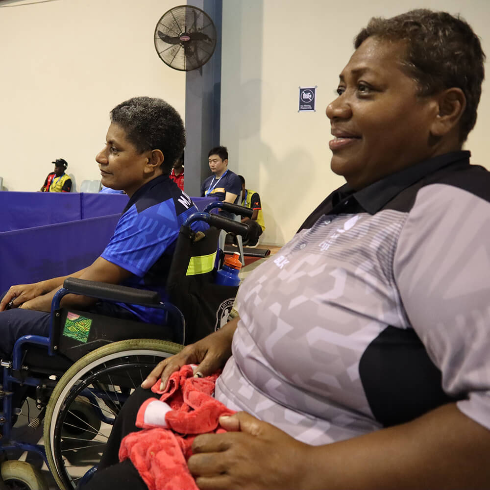 Two women in wheelchairs