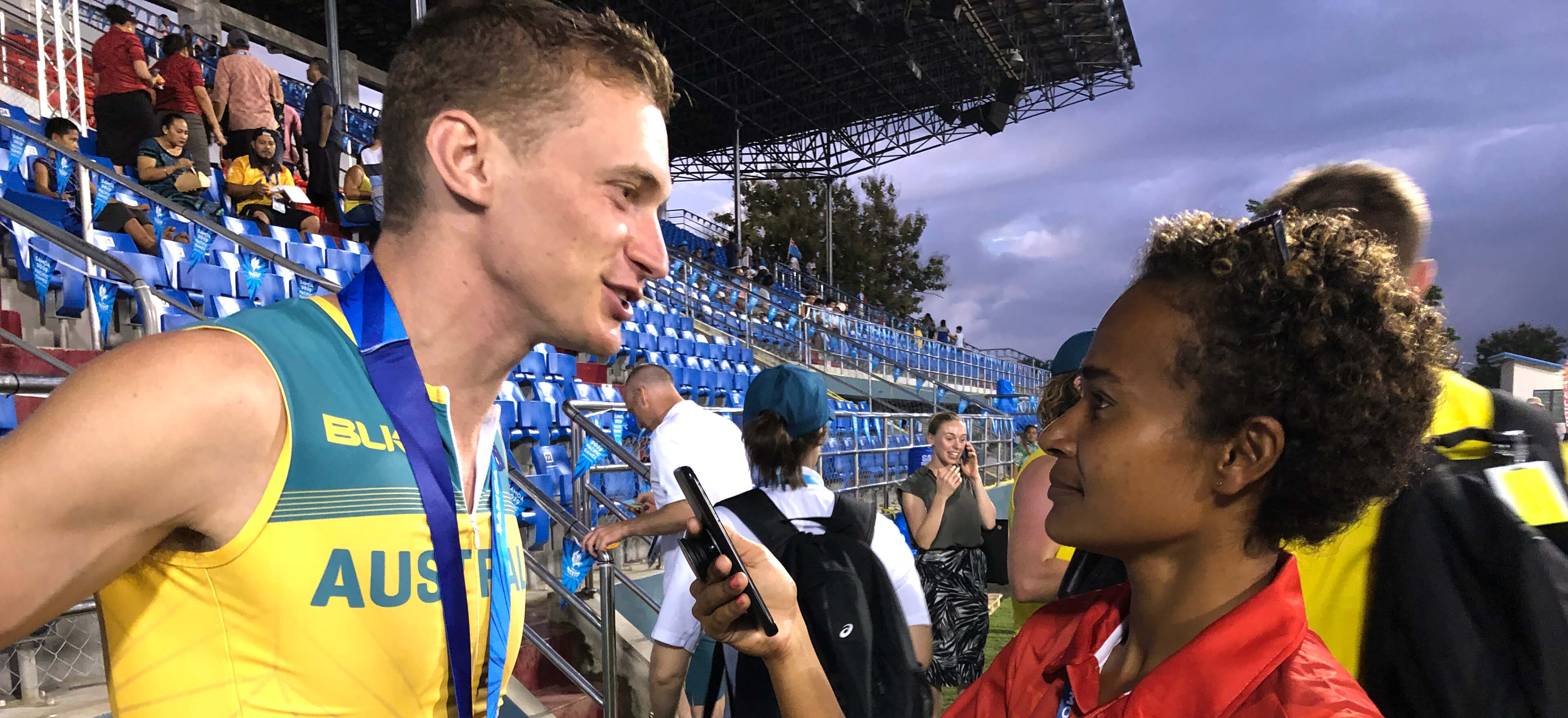 Journalist Melissa Fare interviewing athlete Steve Solomon