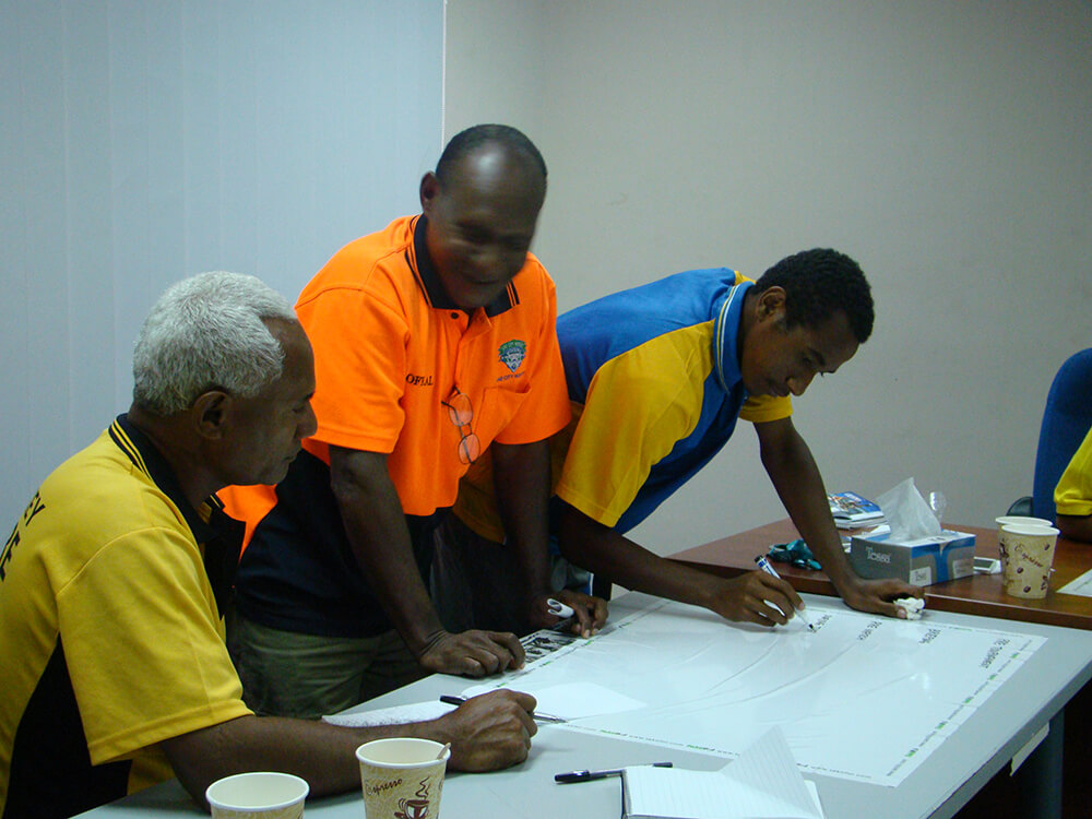 Community members playing hockey in Papua New Guinea