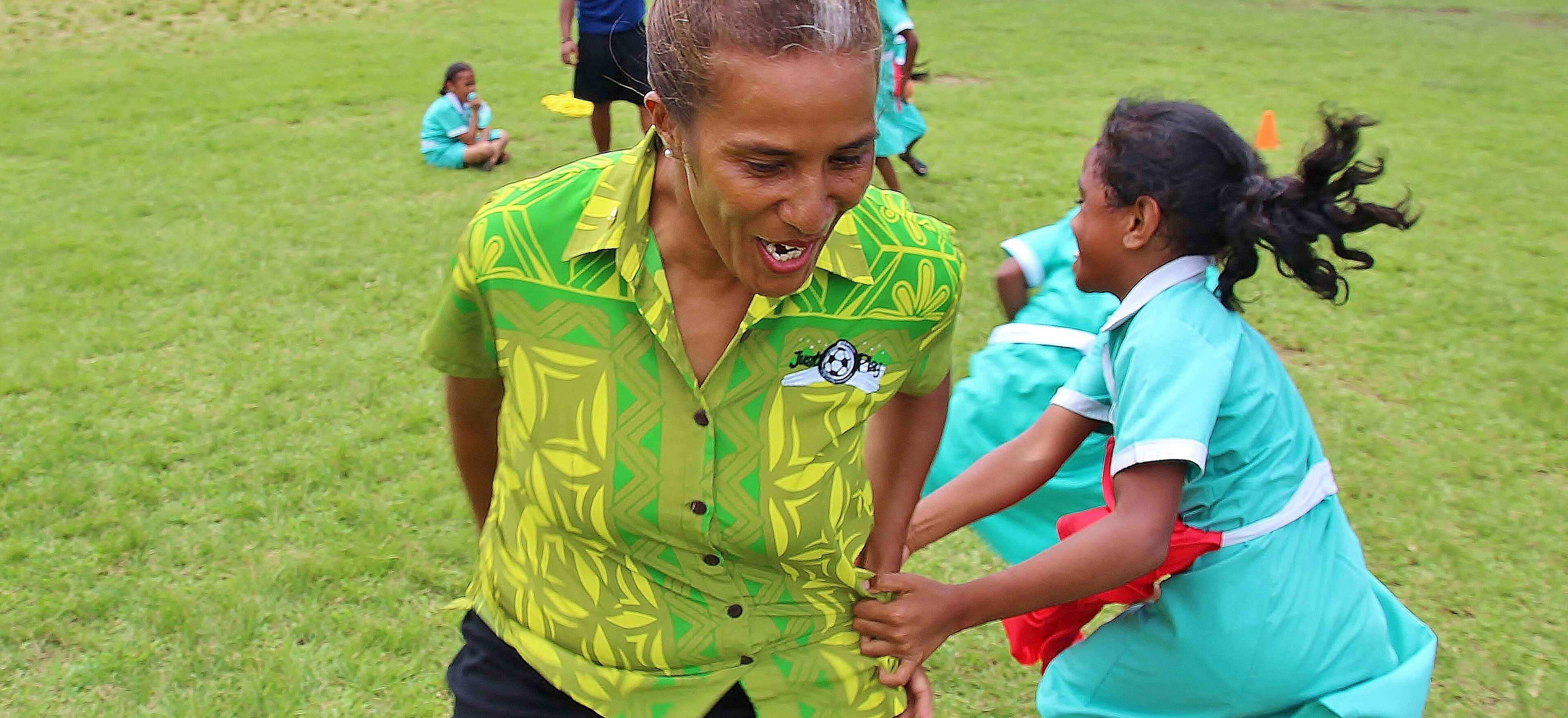woman and girl playing tag