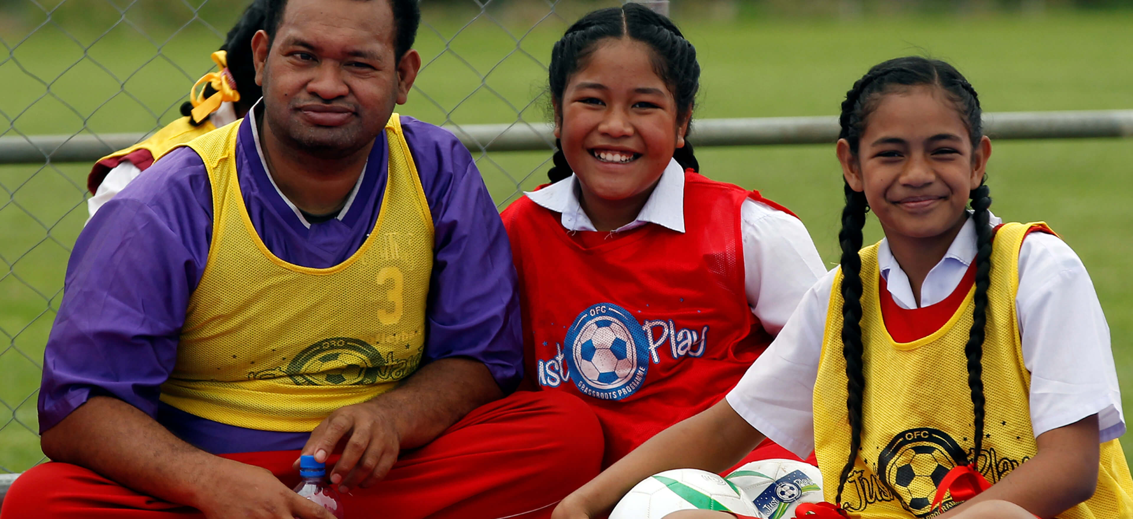 Three young football players in Tonga