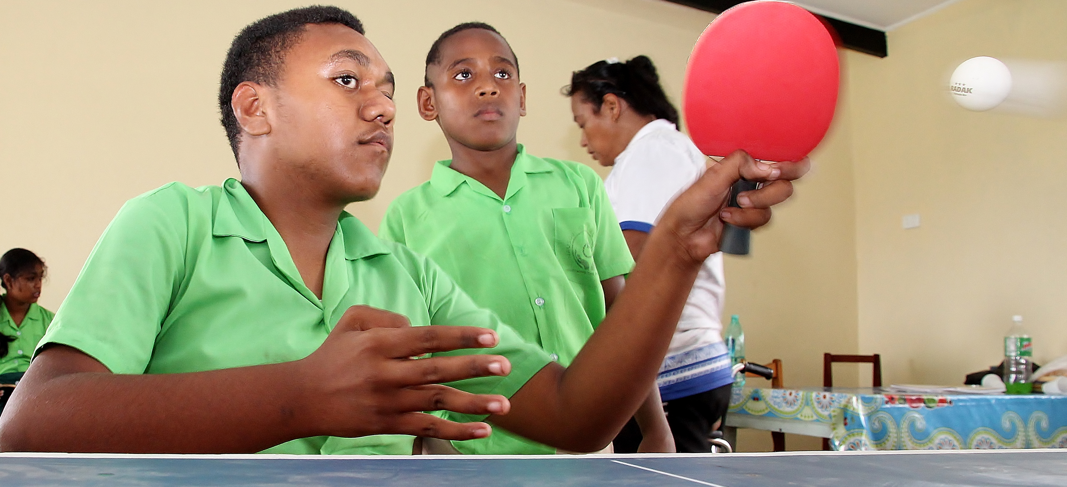 Two boys playing table tennis in Fiji