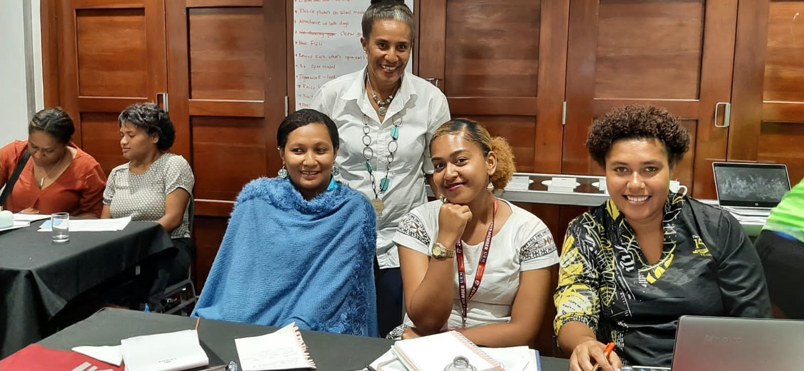 Women smiling at a workshop in Fiji