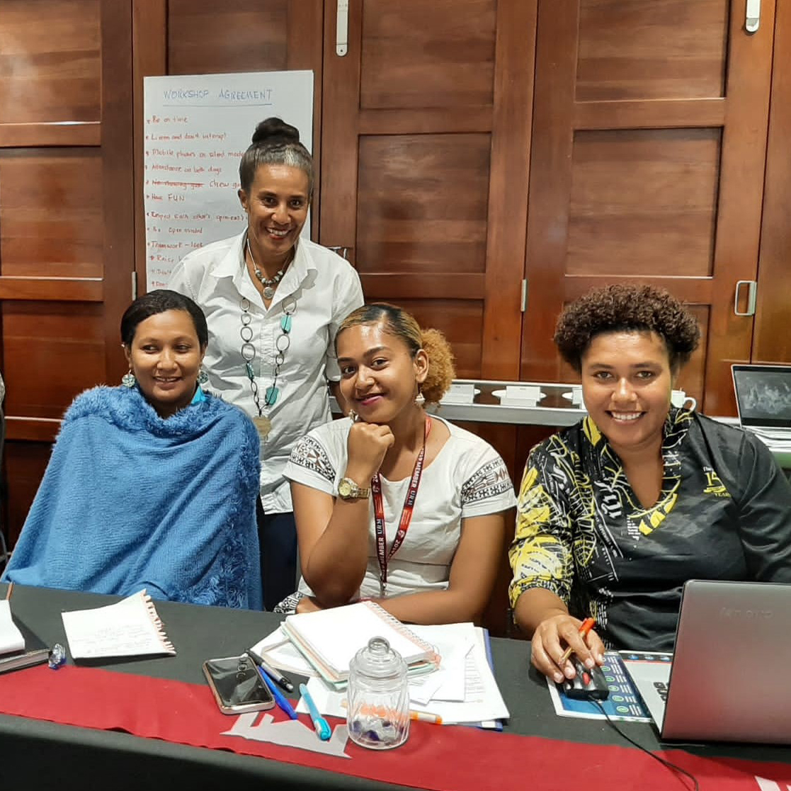 Women smiling at a workshop in Fiji