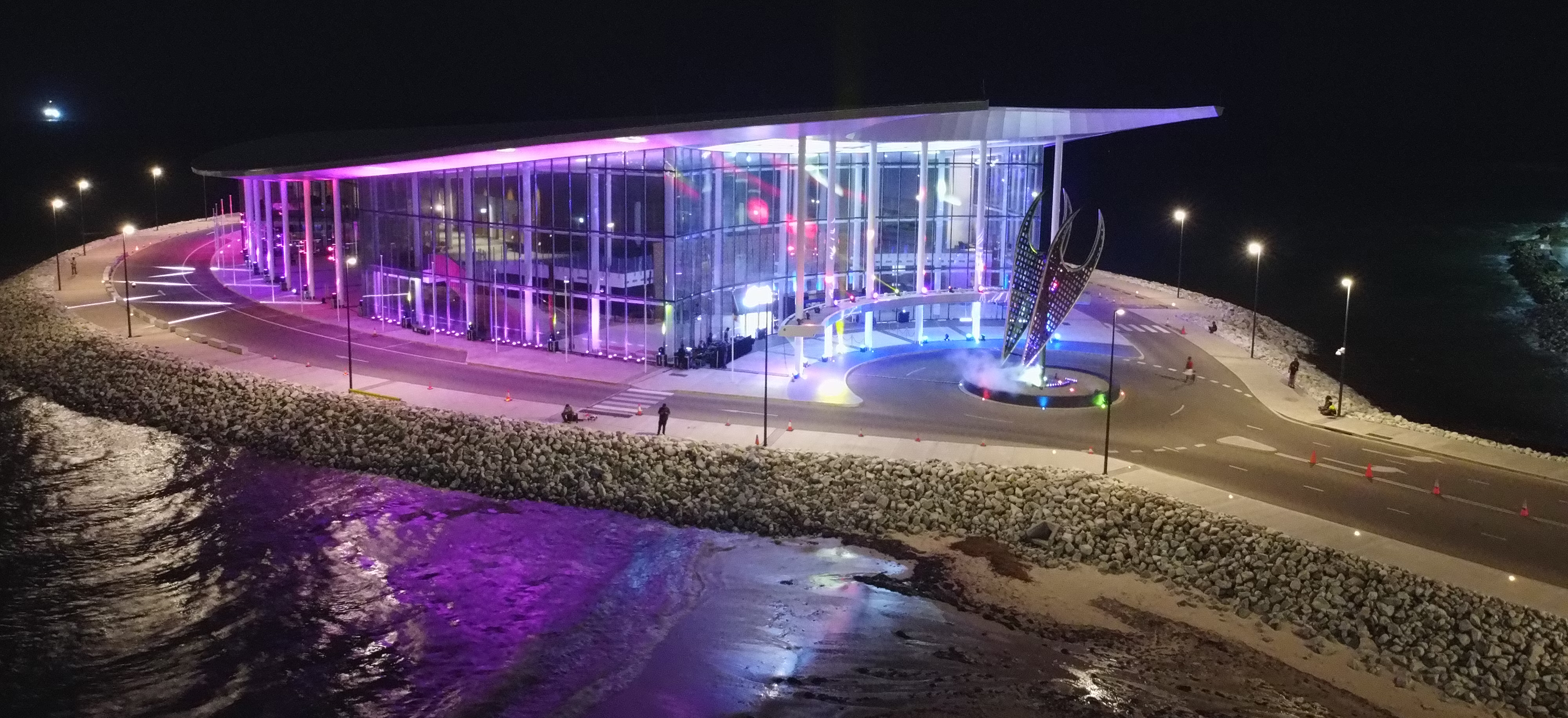 A building illuminated in purple