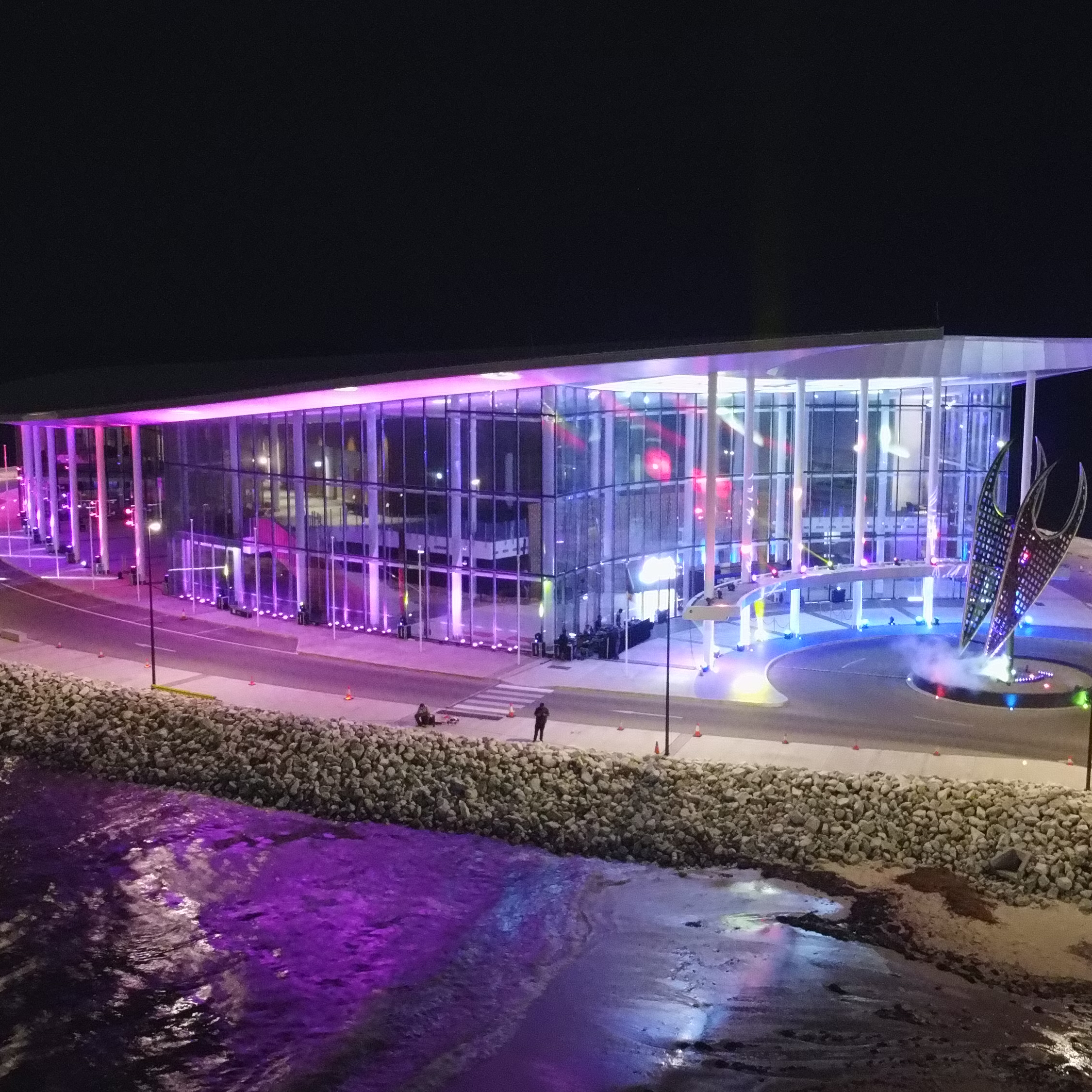 A building illuminated in purple