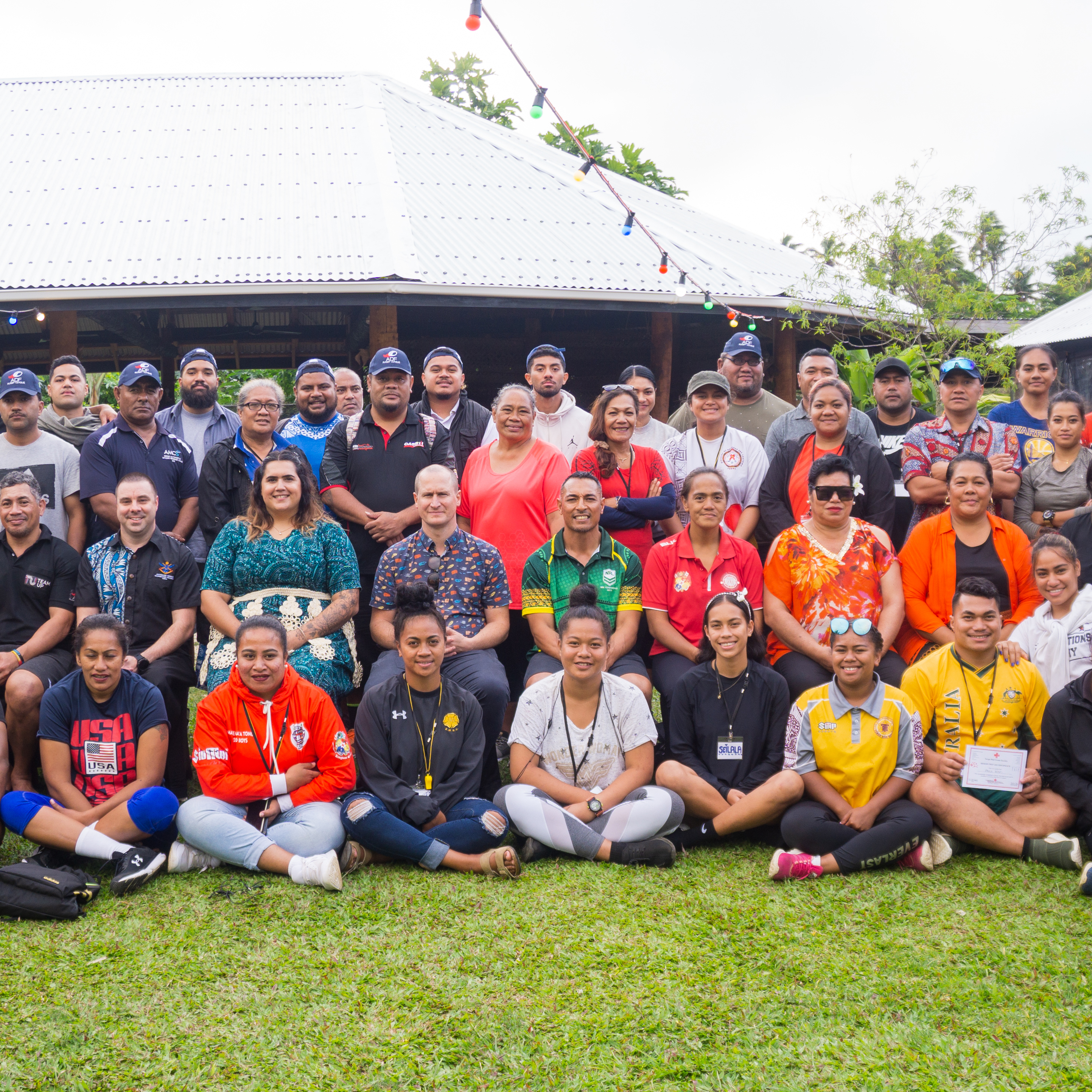 A group of people in Tonga smiling for a photo