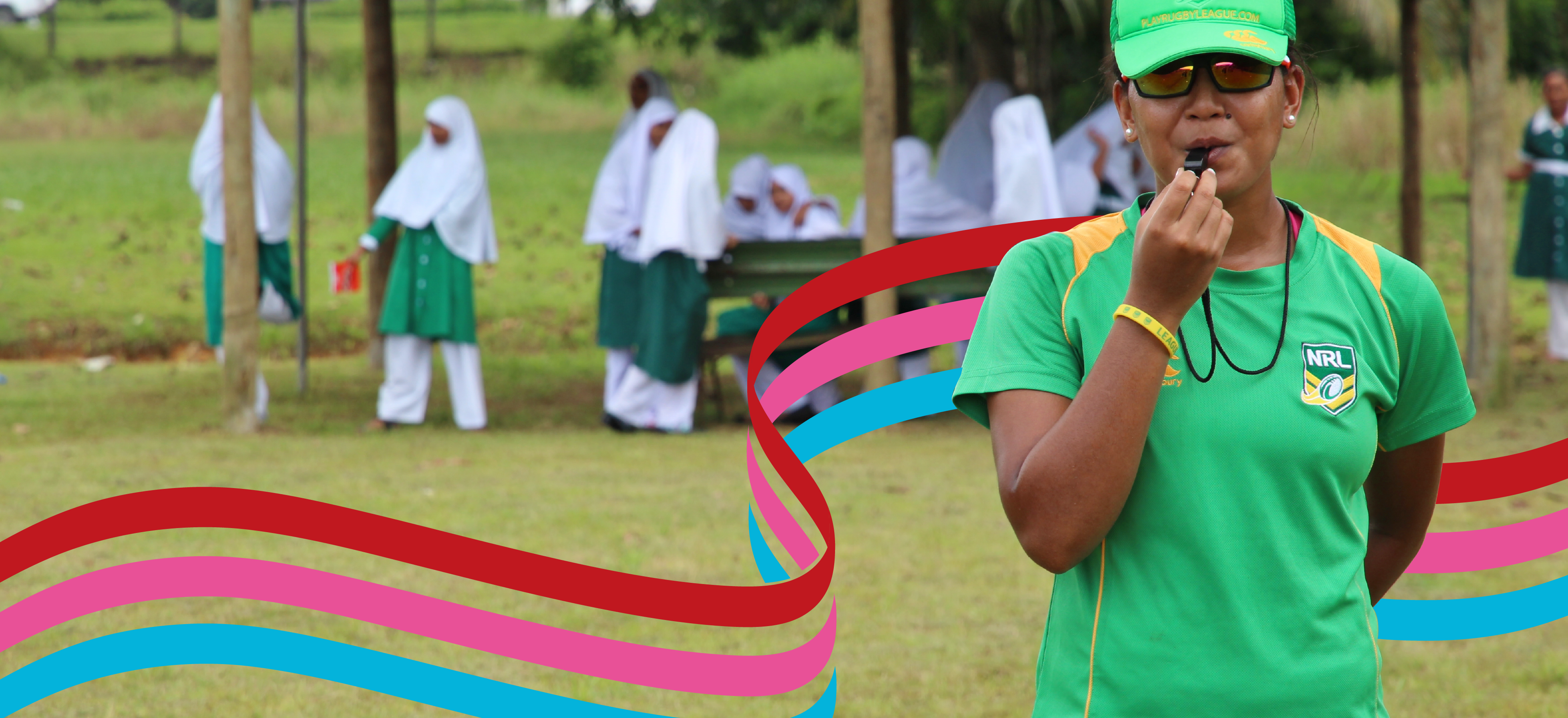 A sports official in Fiji blowing a whistle