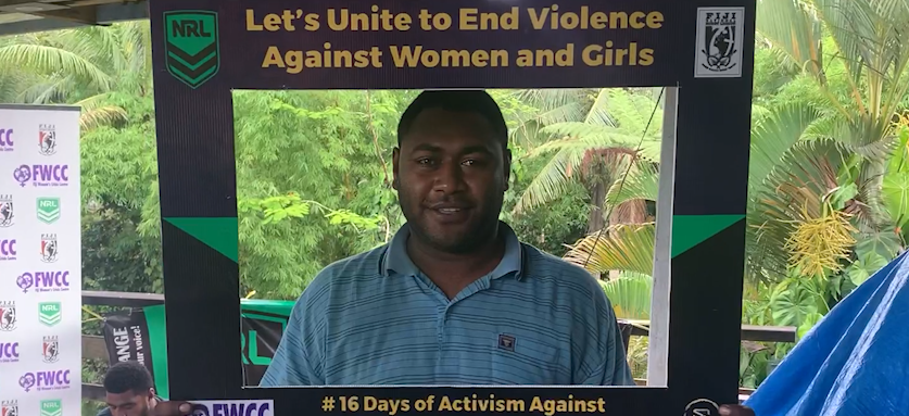 A man in Fiji holding a campaign photo frame