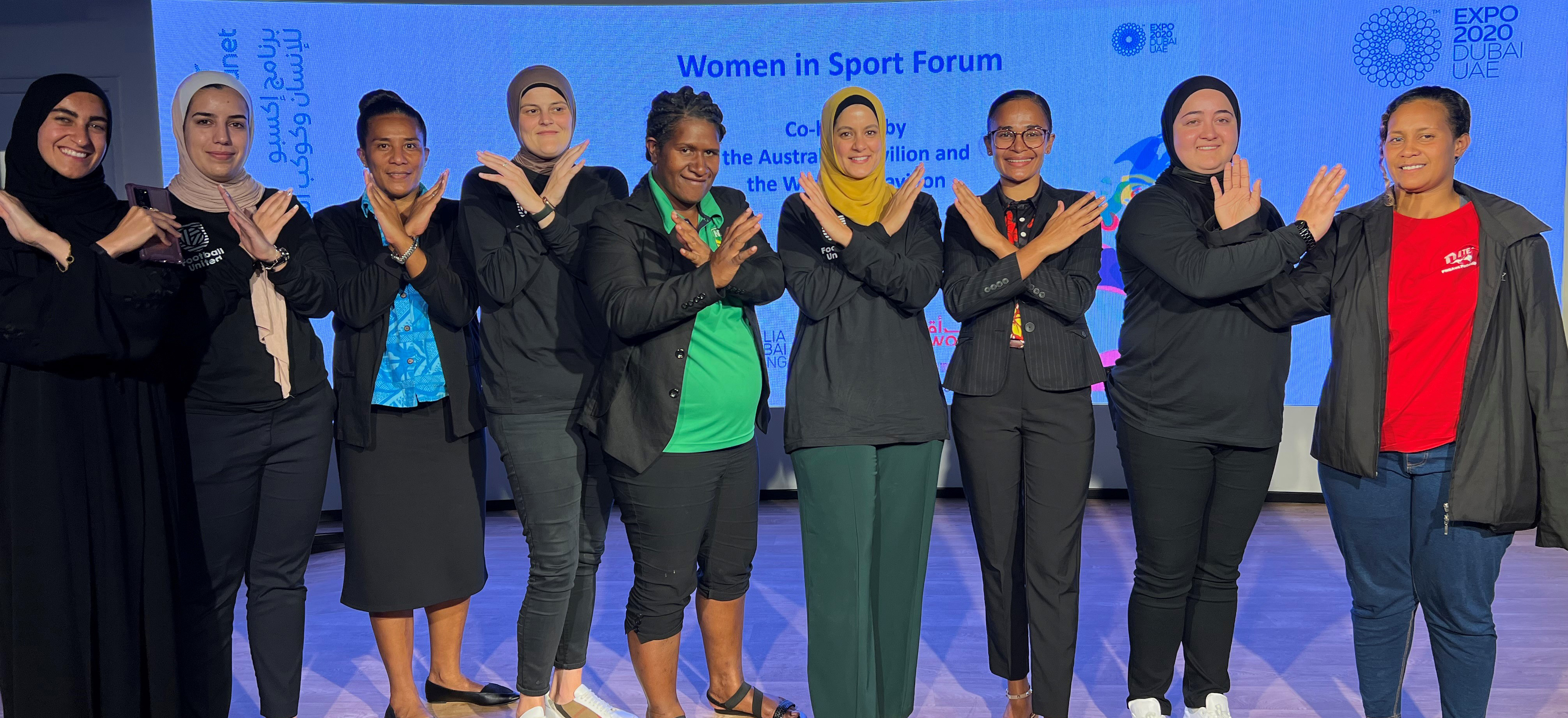 Sportswomen posing for a photo 