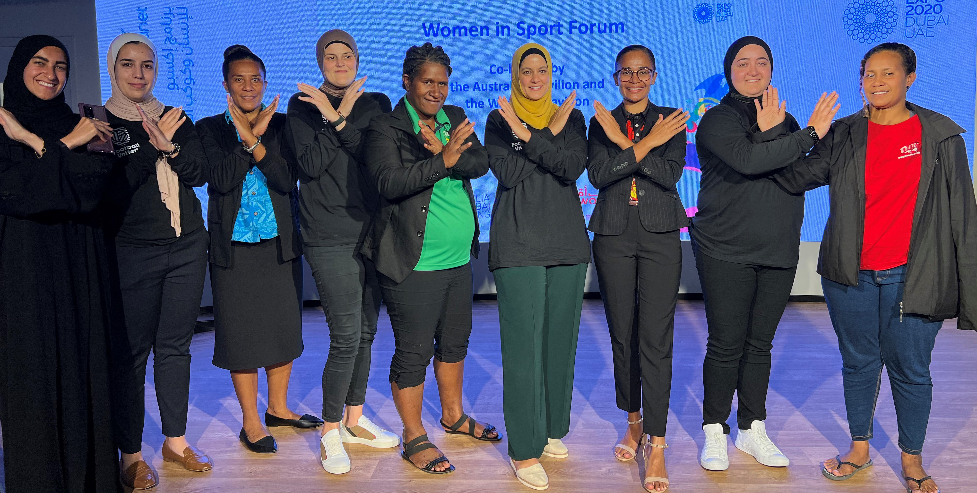 Sportswomen posing for a photo