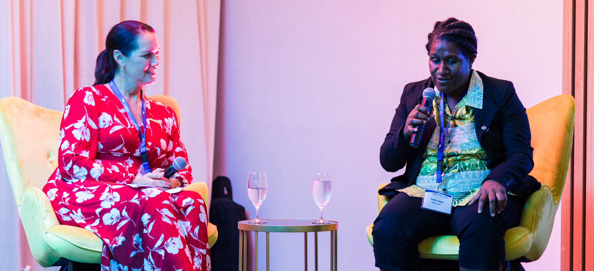 Two women having a conversation on stage