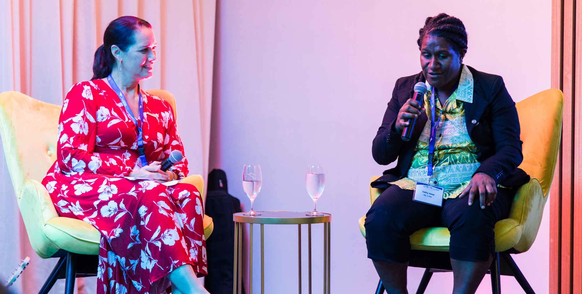 Two women having a conversation on stage