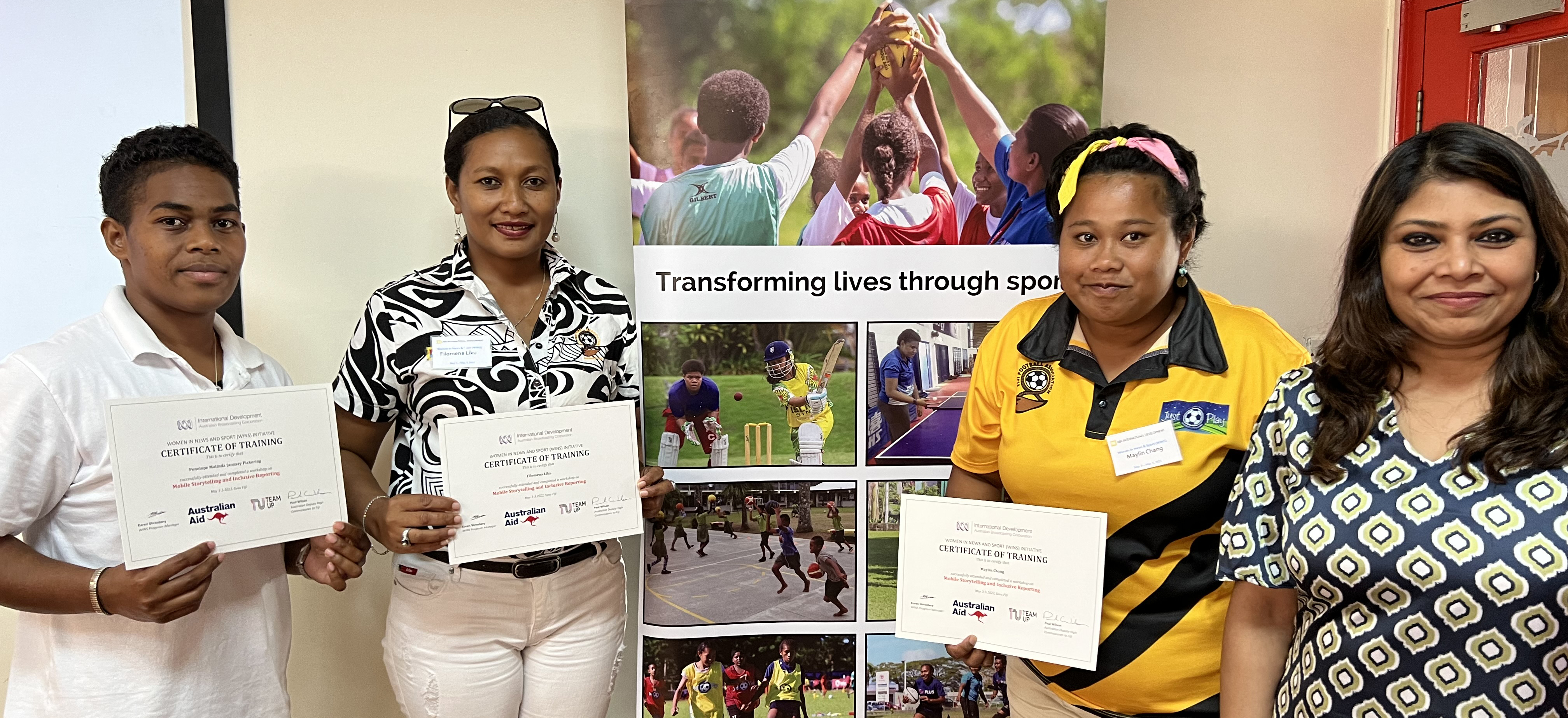 Women in Fiji holding certificates
