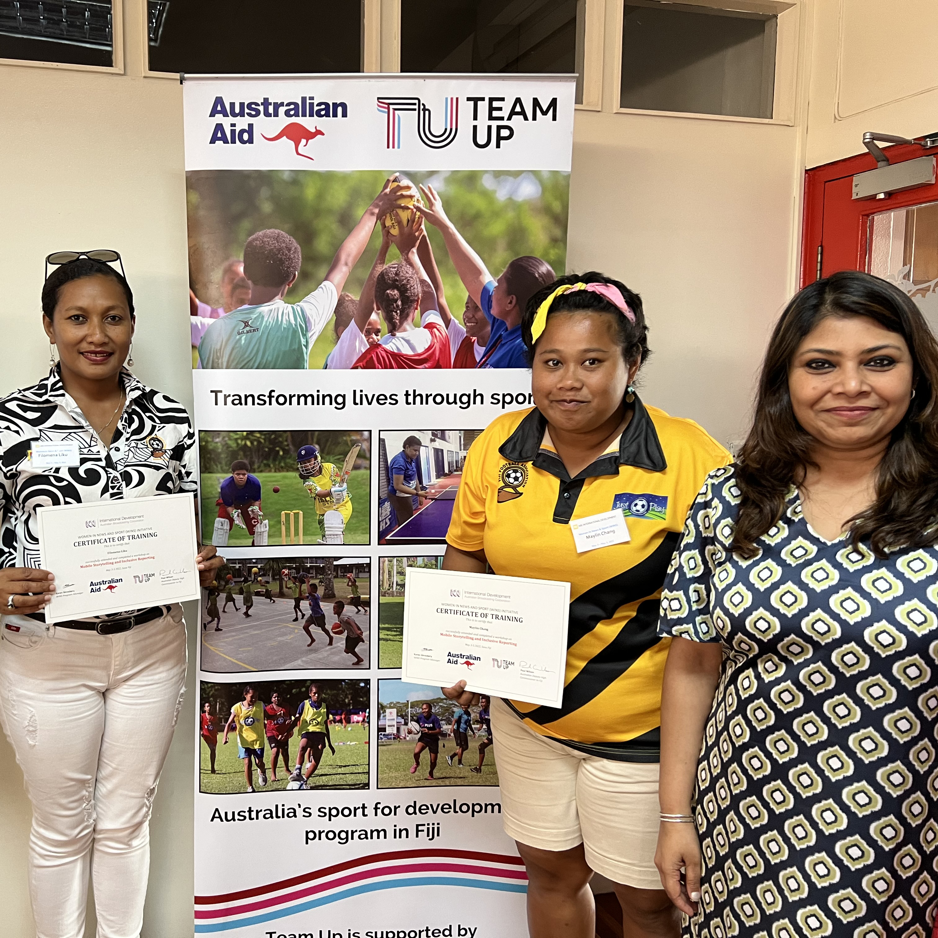 Women in Fiji holding certificates