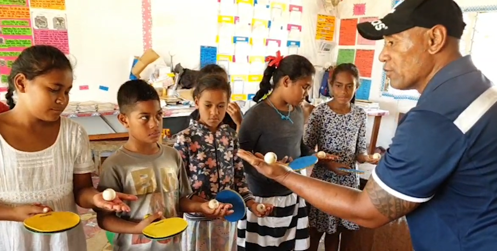 Children in Tonga at a table tennis lesson
