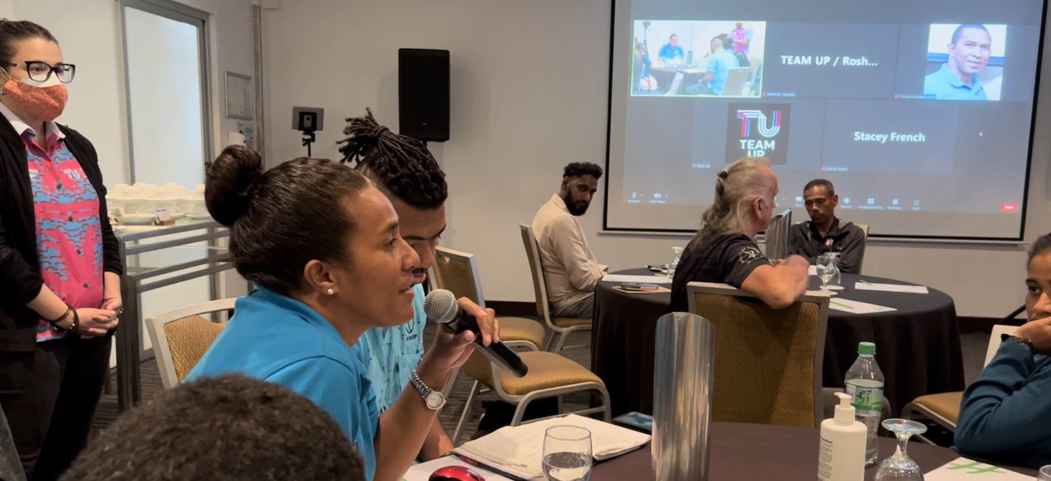 People at a workshop in a meeting room in Fiji