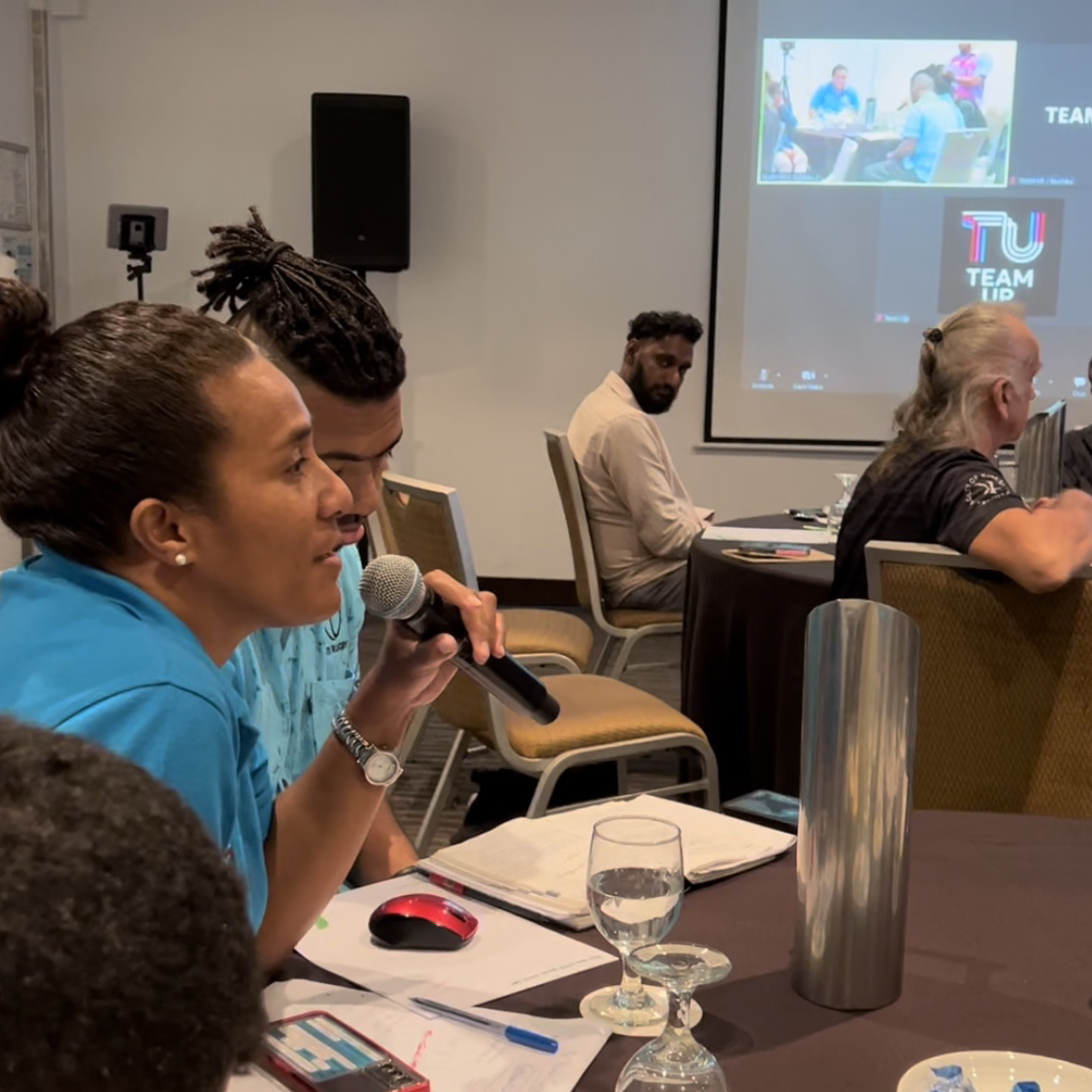 People at a workshop in a meeting room in Fiji