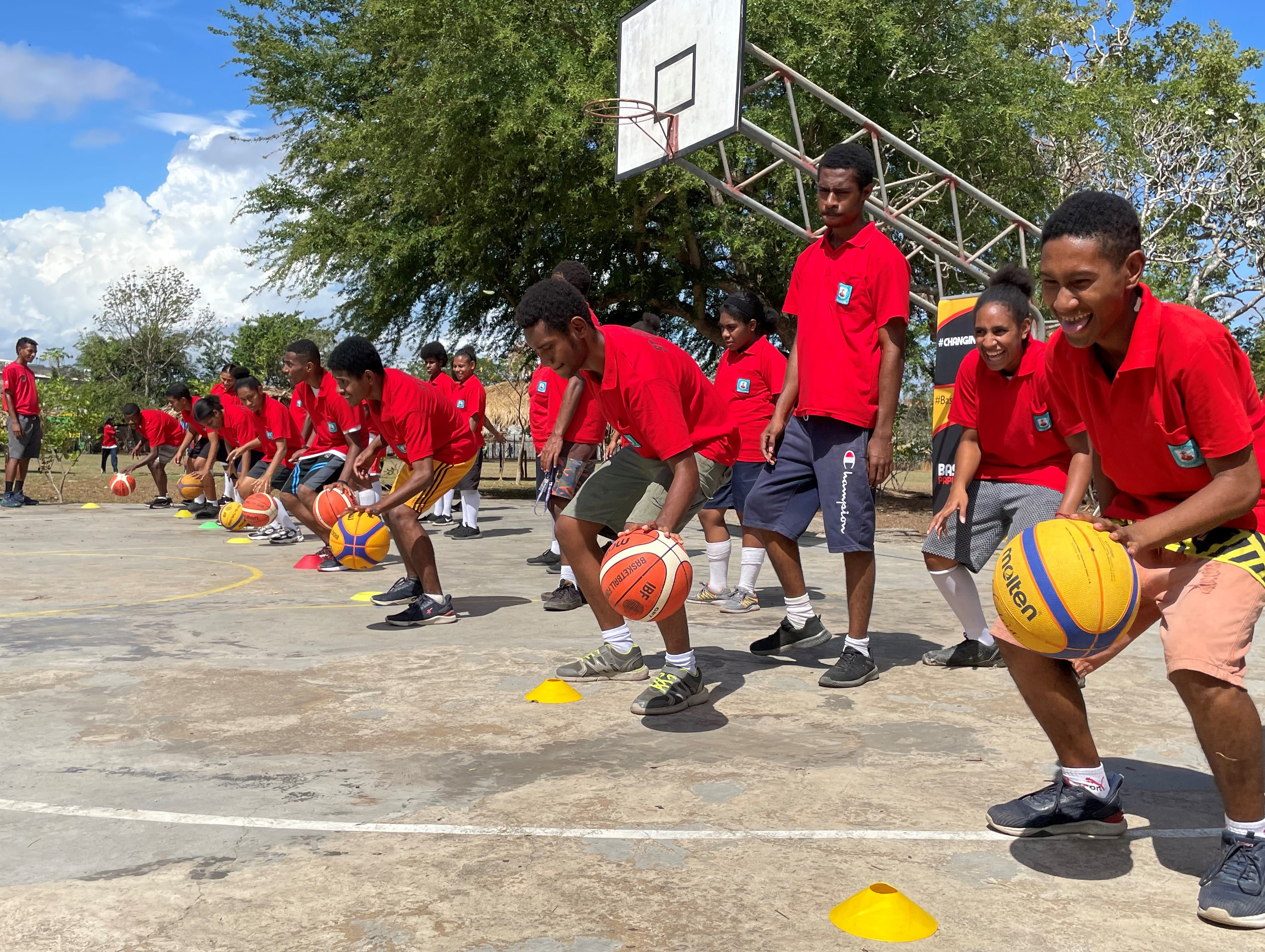 Boys in Papua New Guinea at a basketball skills session 