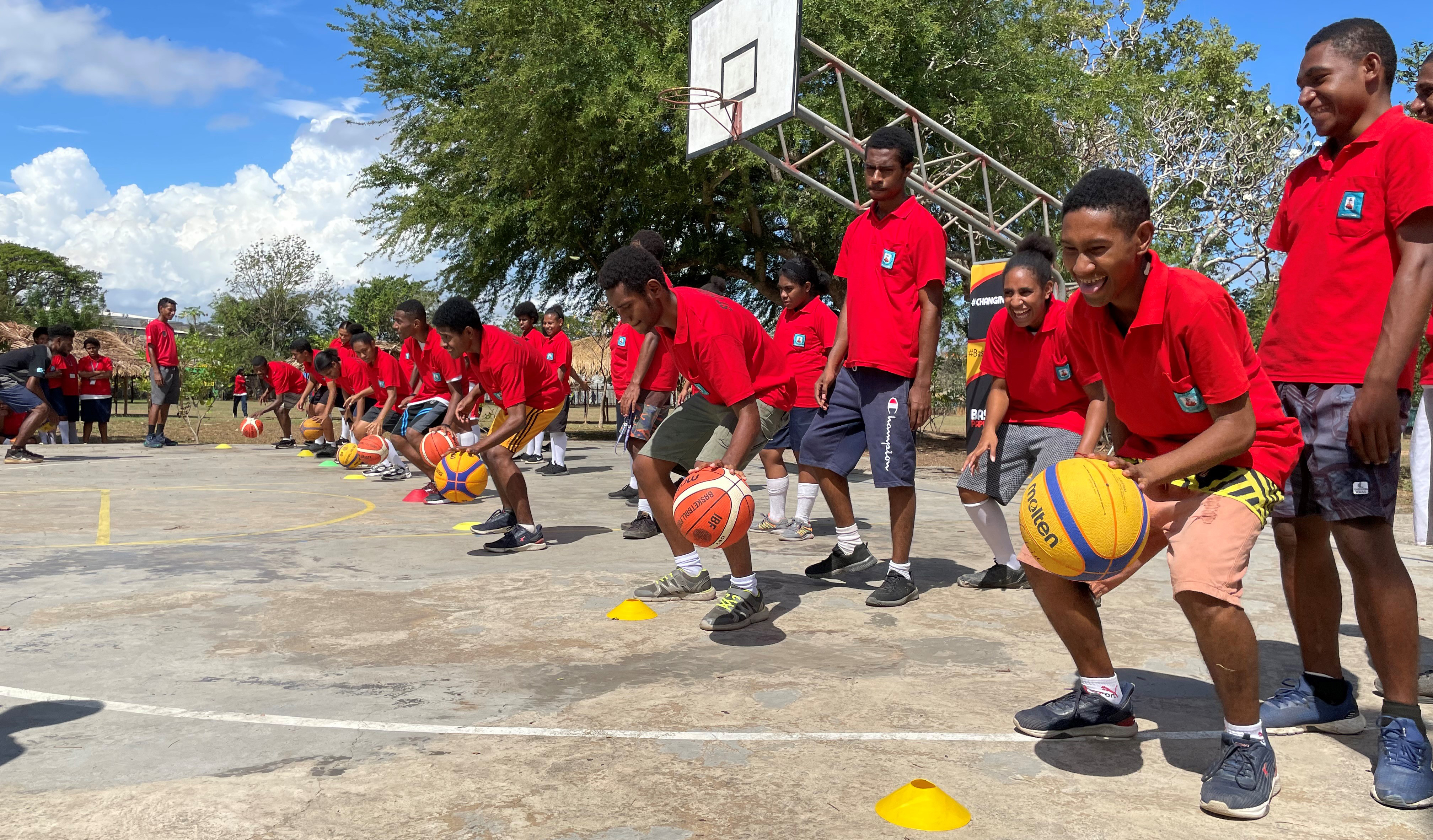 Boys in Papua New Guinea at a basketball skills session