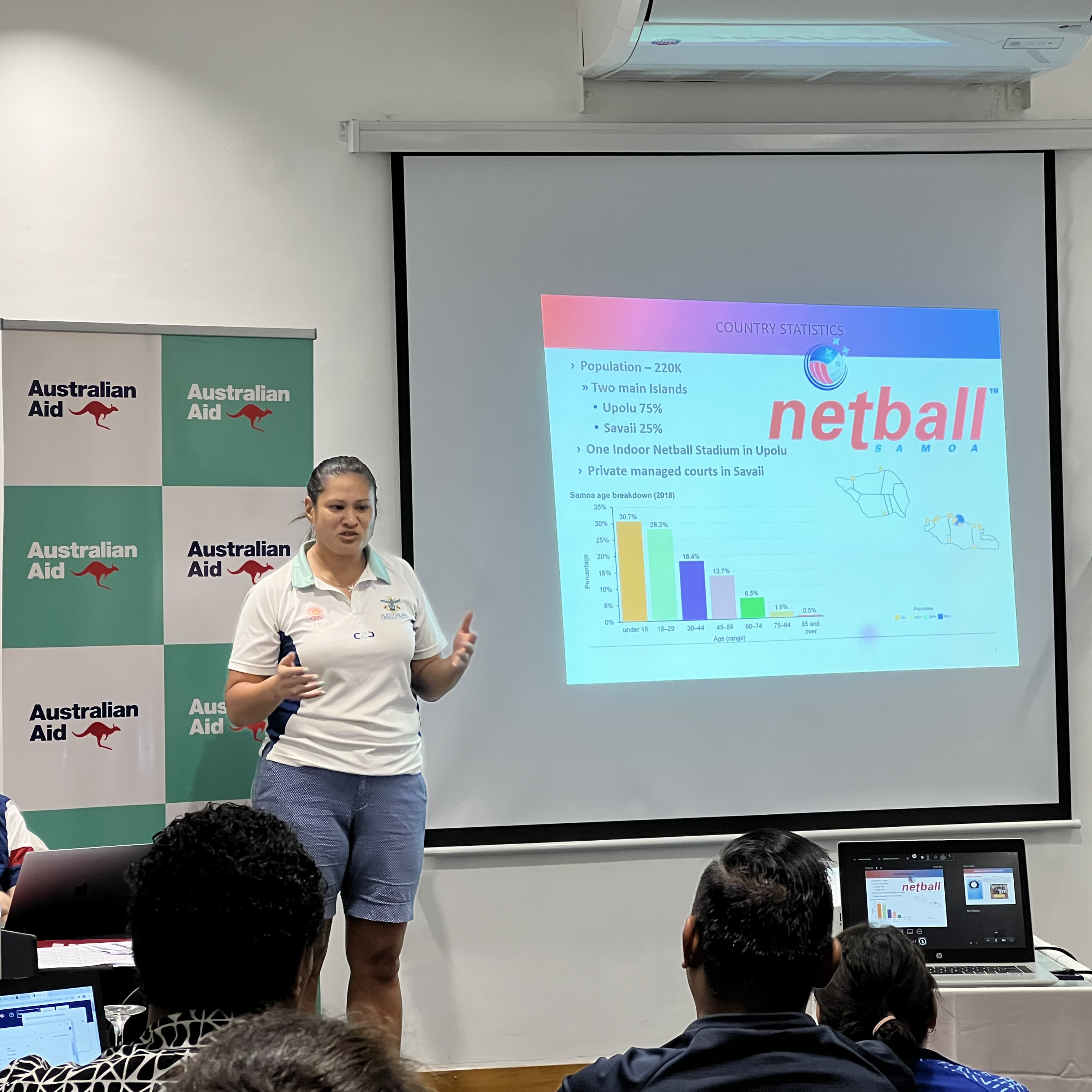 A woman in Samoa speaking during a workshop 