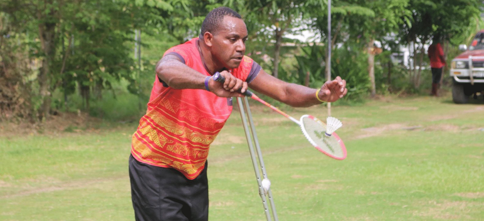 A man with a disability in Papua New Guinea playing badminton