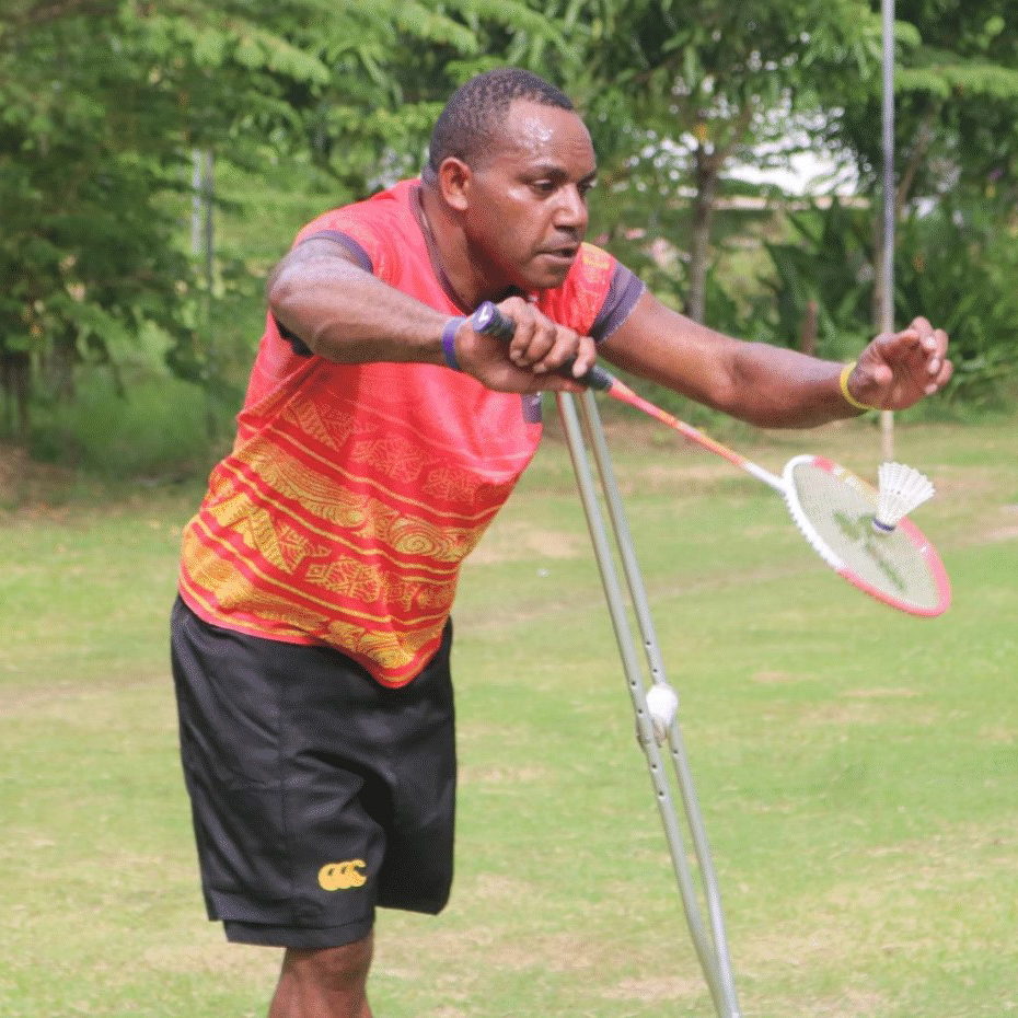 A man with a disability in Papua New Guinea playing badminton