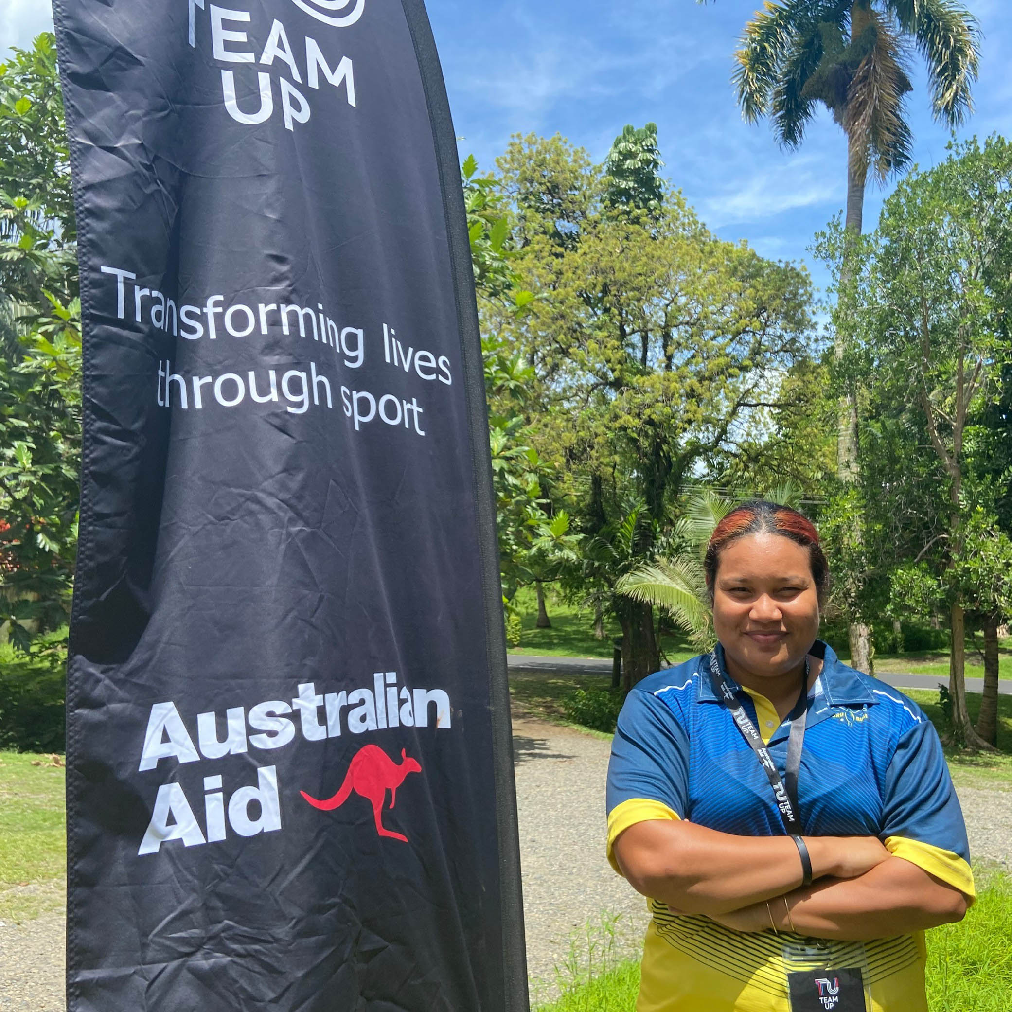 A female sports officer from Nauru smiling for a photo