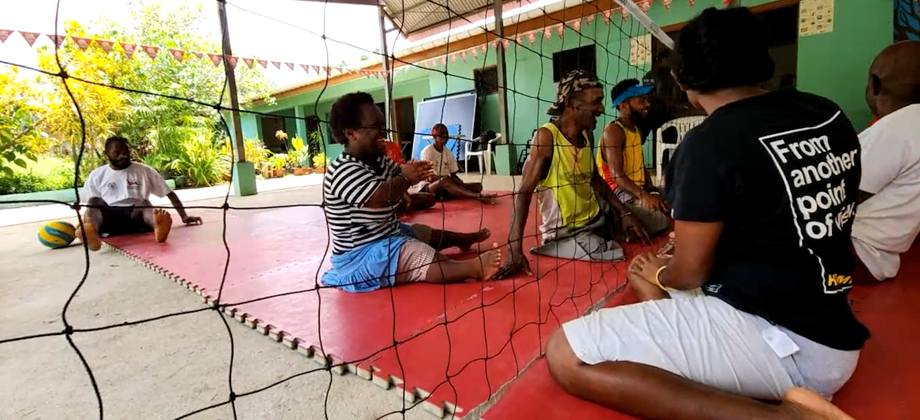 People in Vanuatu playing seated volleyball