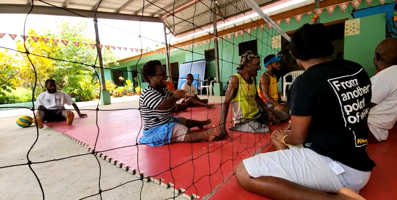 People in Vanuatu playing seated volleyball