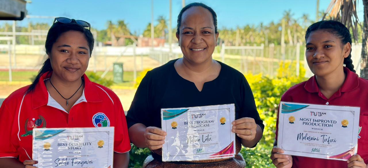 Three women in Tonga holding certificates