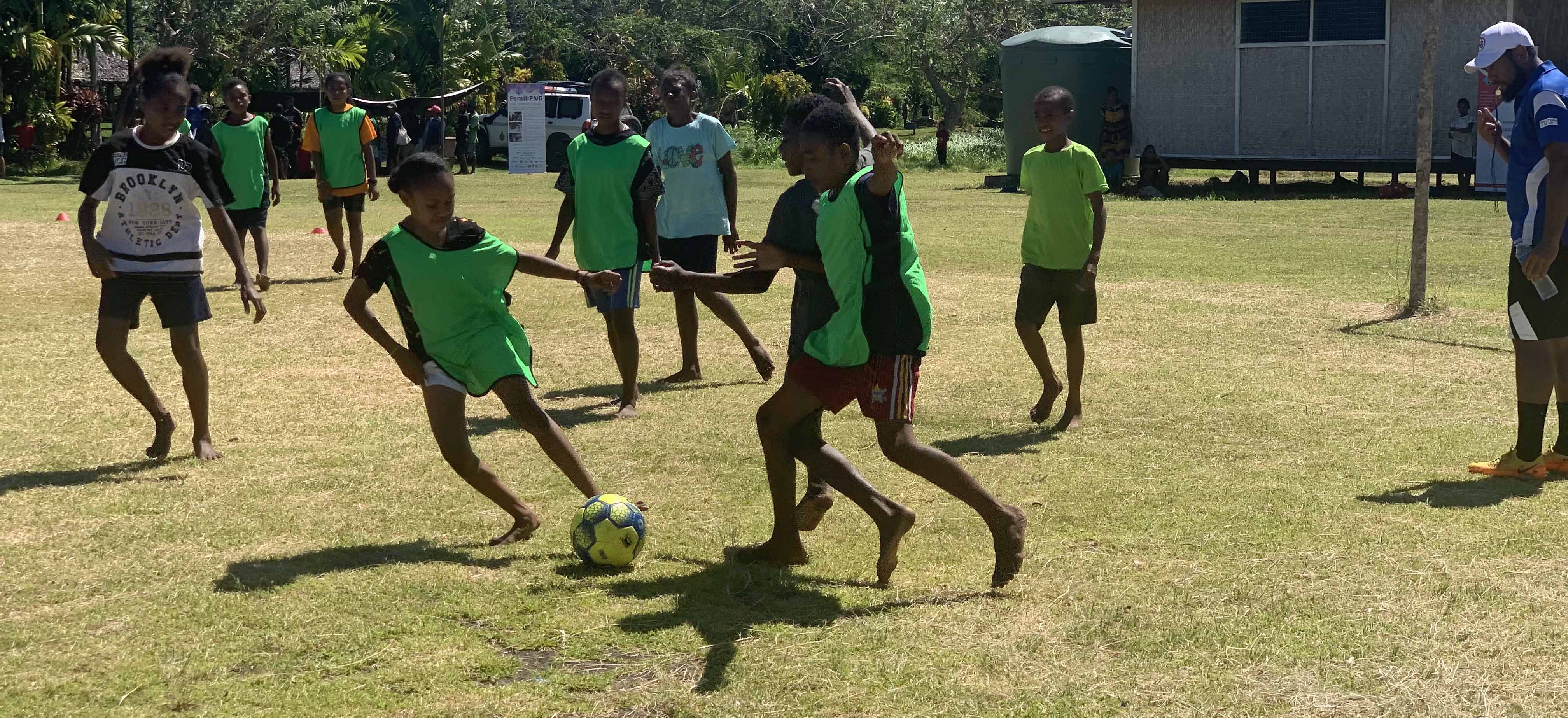 Children in Papua New Guinea playing football