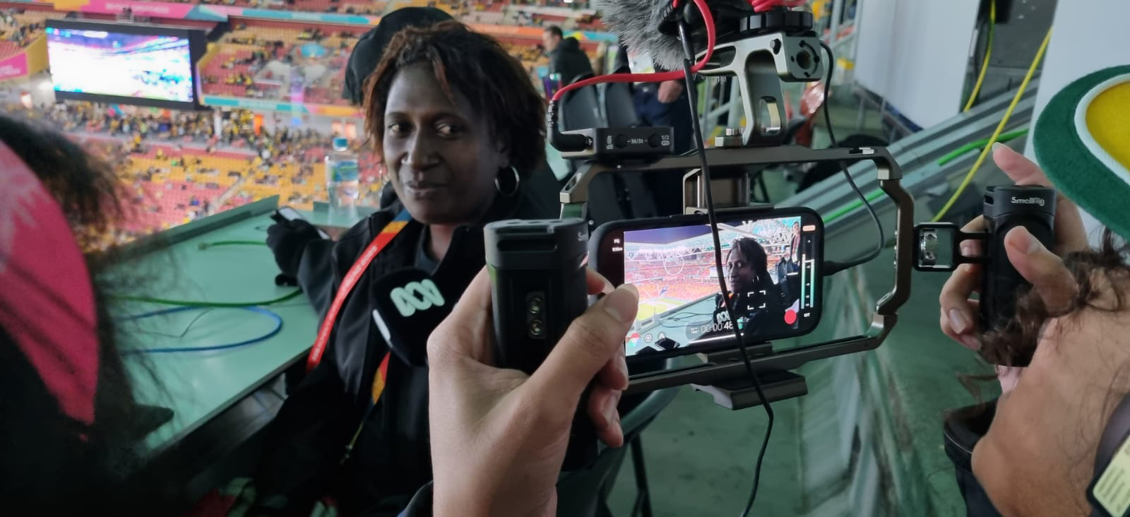 Two women filming on mobile phones