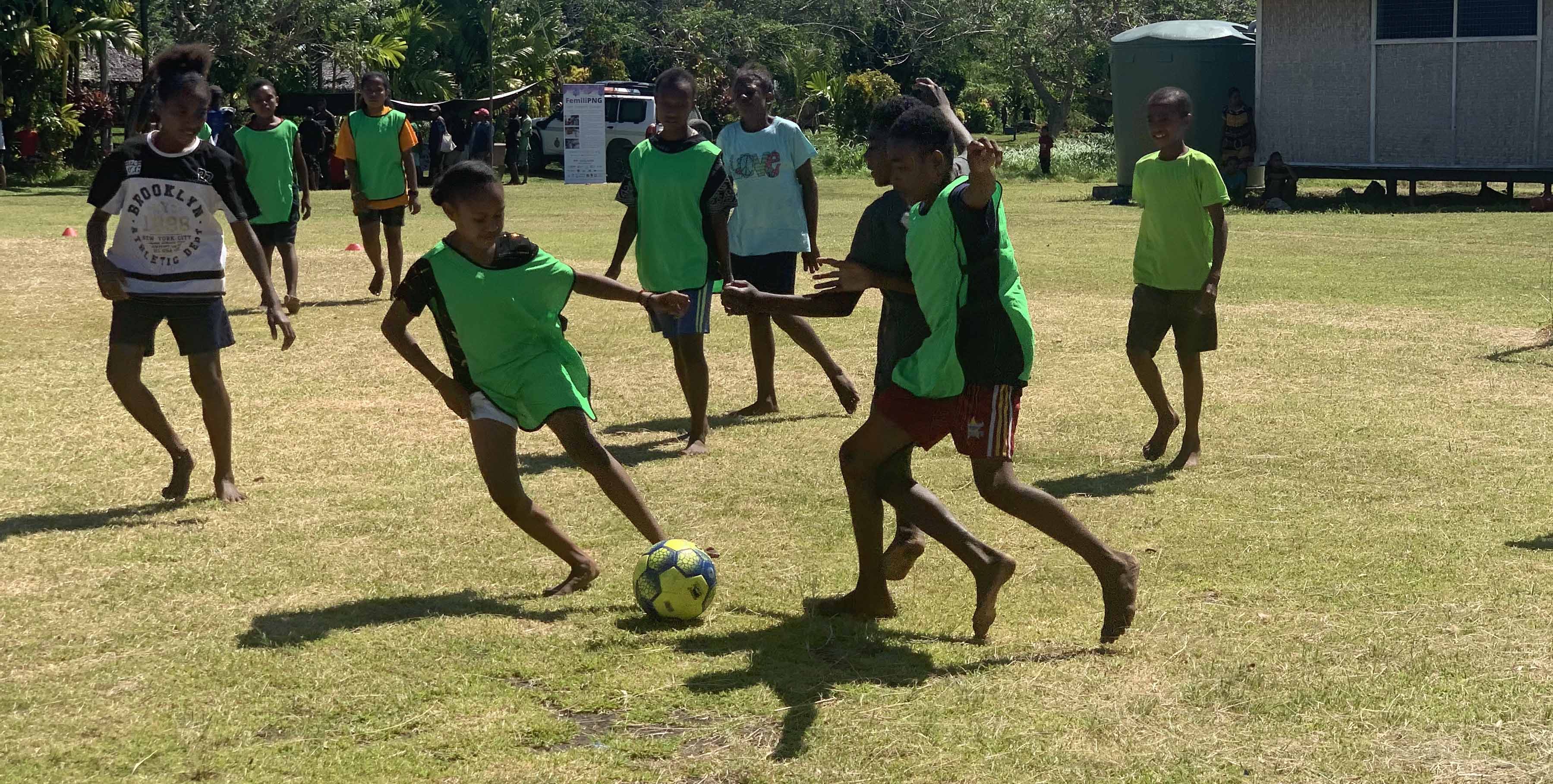 Children in Papua New Guinea playing football 