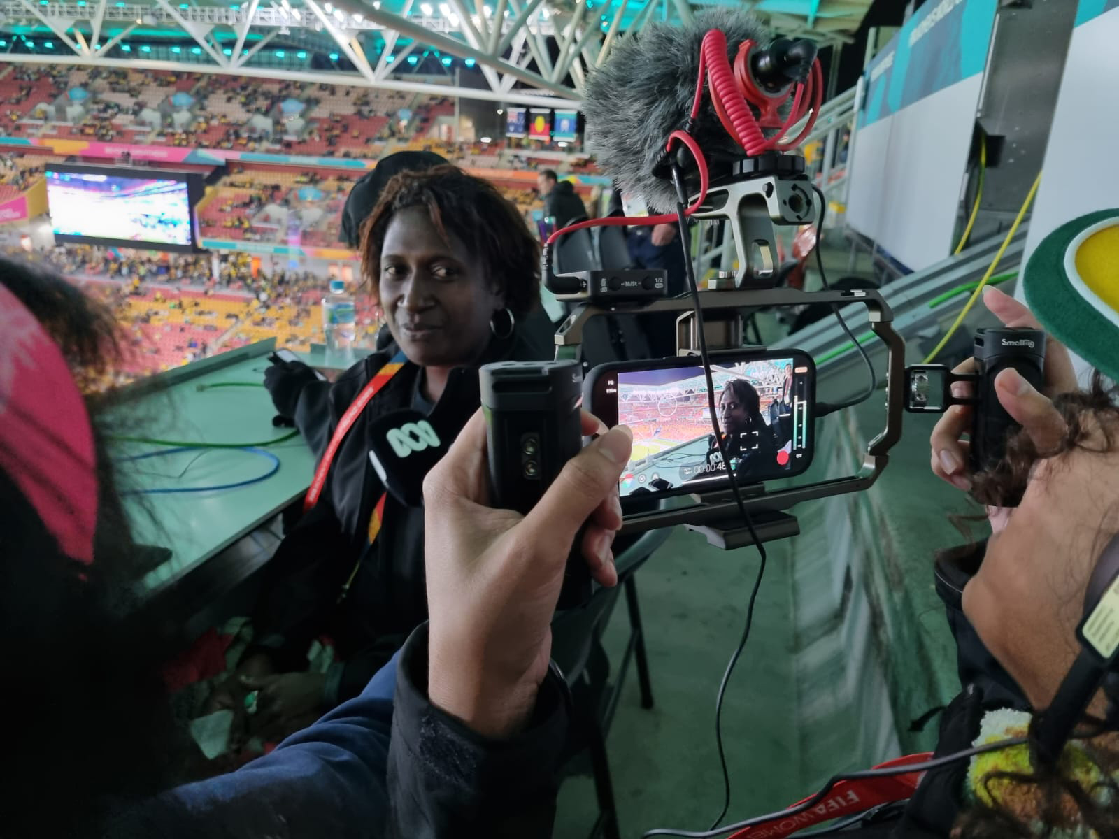 Two women filming on mobile phones