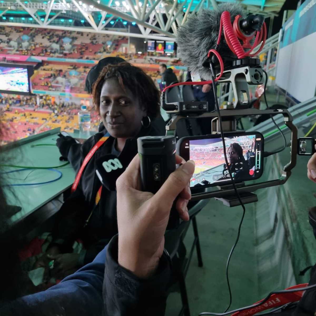 Two women filming on mobile phones