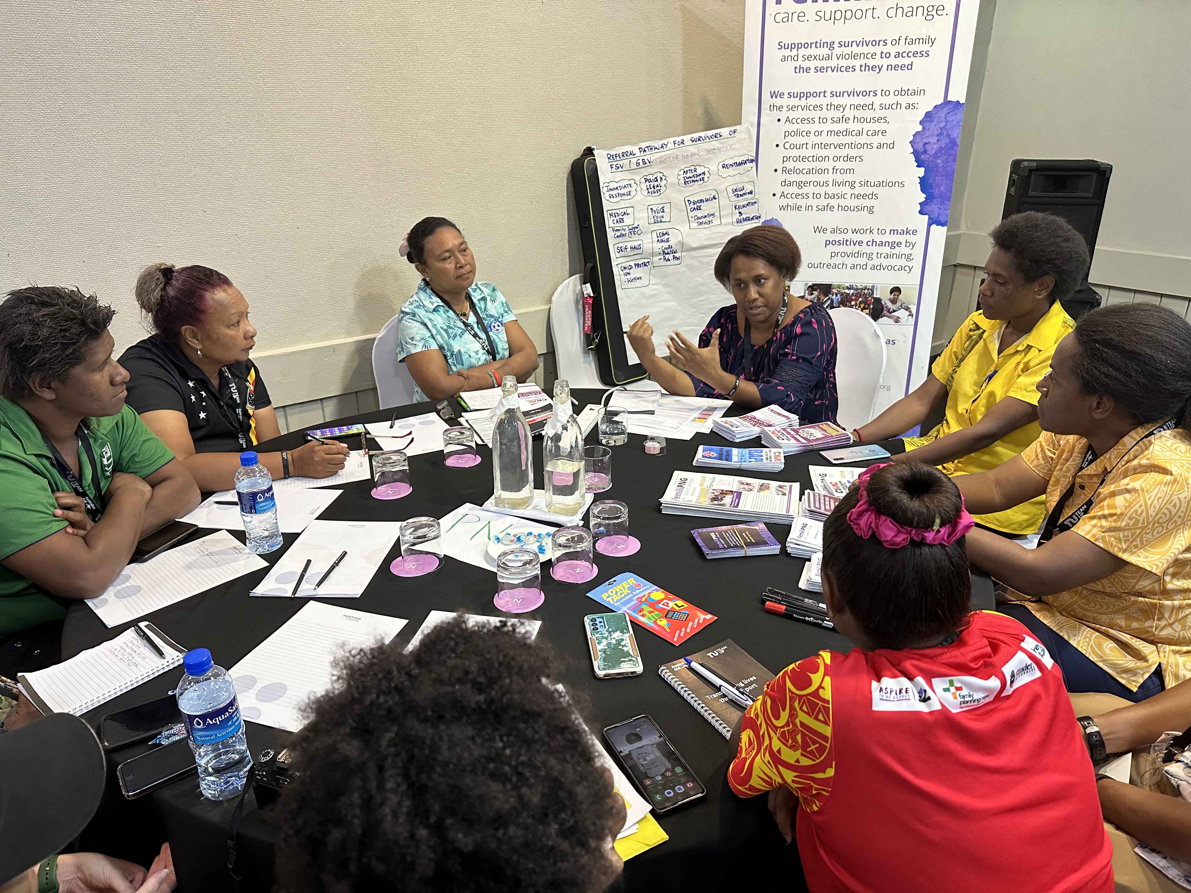 People sitting around a table at a workshop