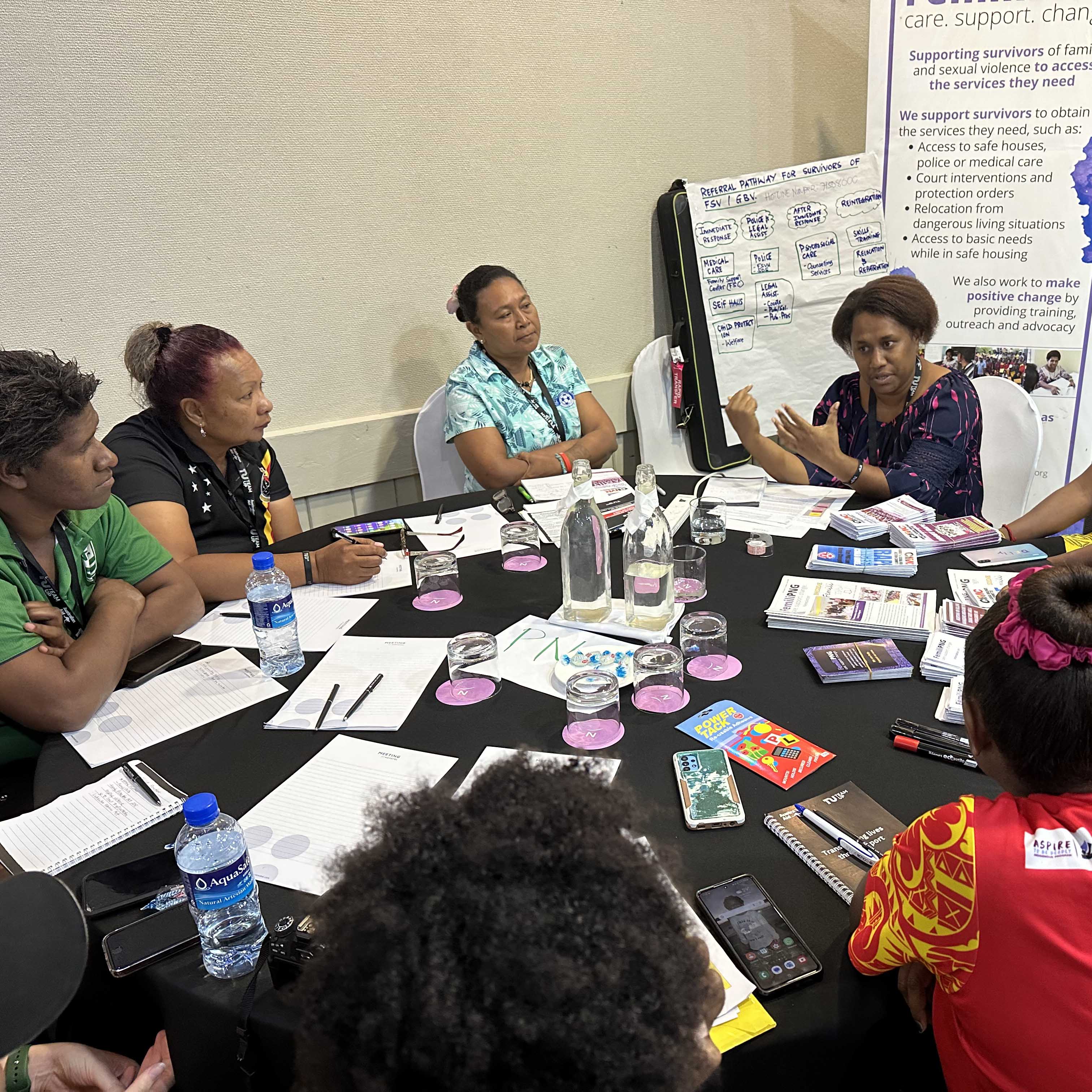 People sitting around a table at a workshop